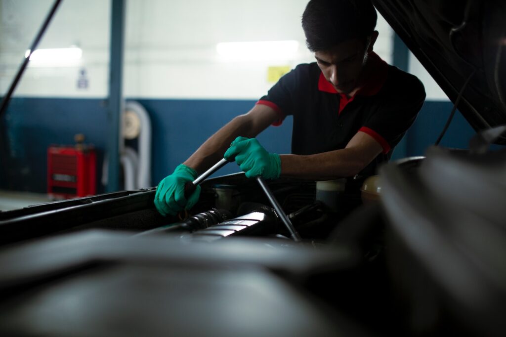 A mechanic using a torque wrenge (source pexels-fatih-erden-10490623)