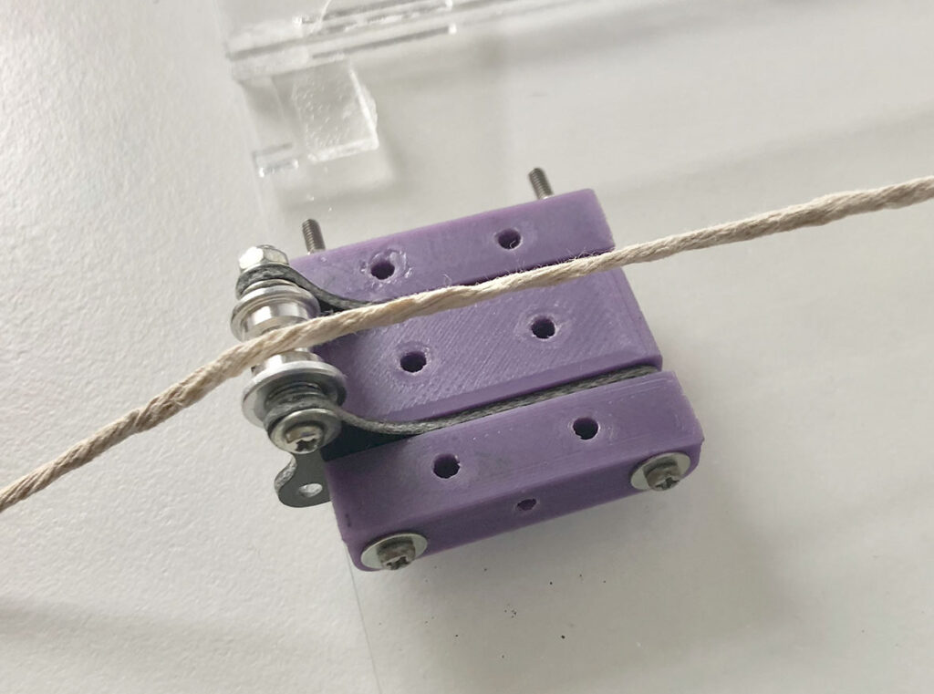 A pulley made for the brake pad test experiment using Tamiya Mini 4Wd parts and 3D printed parts